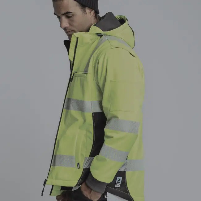 man wearing winter hi vis yellow jacket with reflective tape 