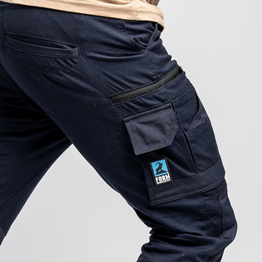 Close-up of back pocket design on Form Workwear FB1 navy work pants, showcasing durable stitching and utility features