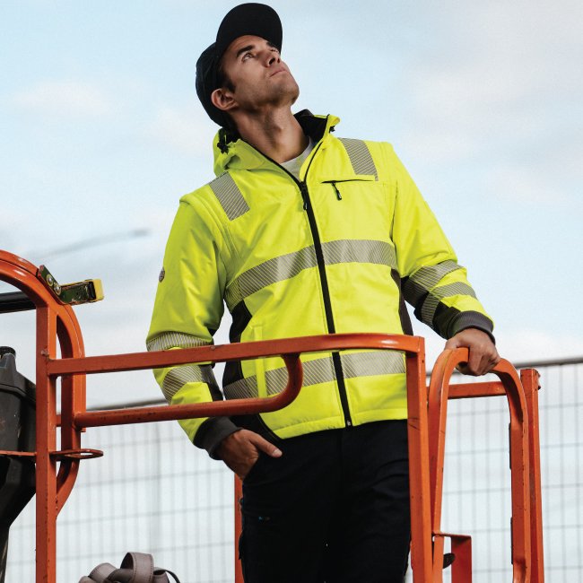 electrician wearing hi vis safety jacket with removable sleeves form workwear