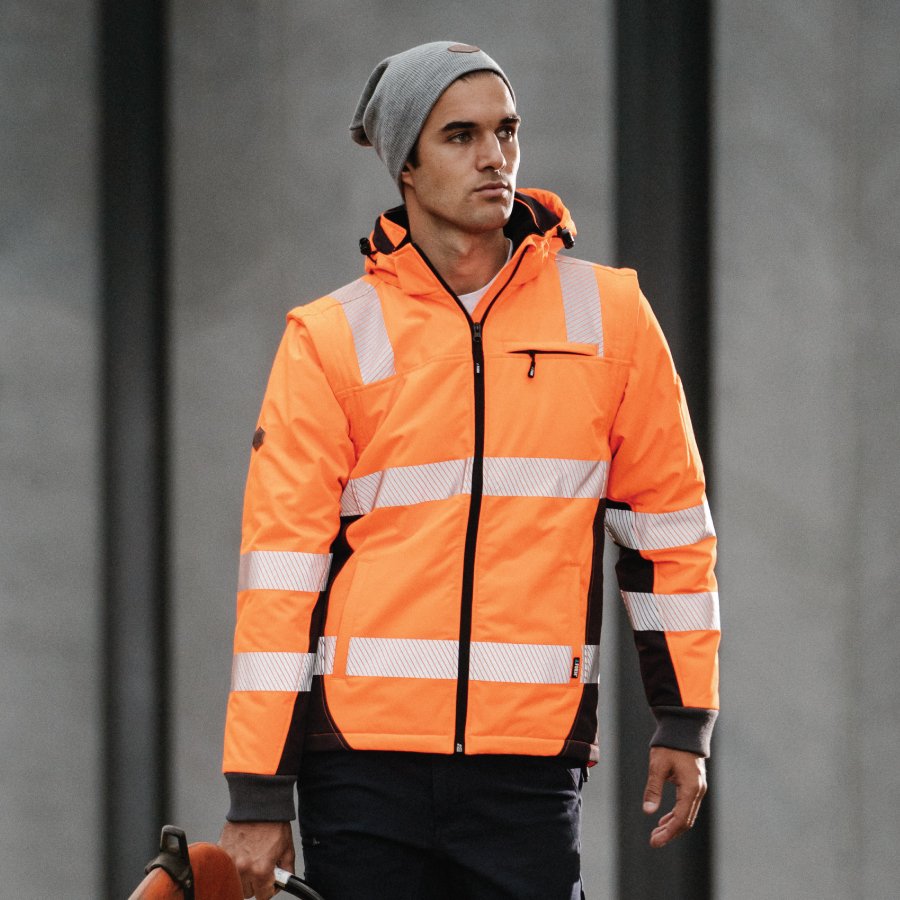 construction man wearing compliant hi vis orange jacket