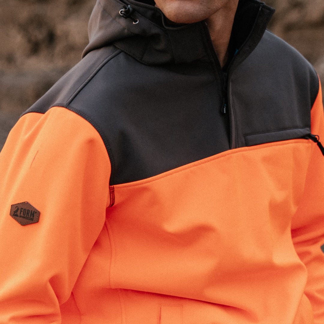 Close-up of Form Workwear hi-vis jacket with a leather badge on the sleeve