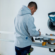 T4 DEXR work hoodie in grey, on model at worksite