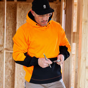 T4 DEXR work hoodie in orange, on model at worksite